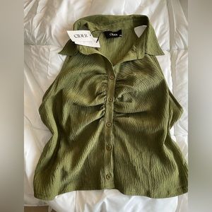 Green sleeveless button up shirt